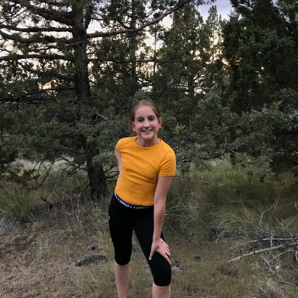 yellow h&m top paired with black under armor pants